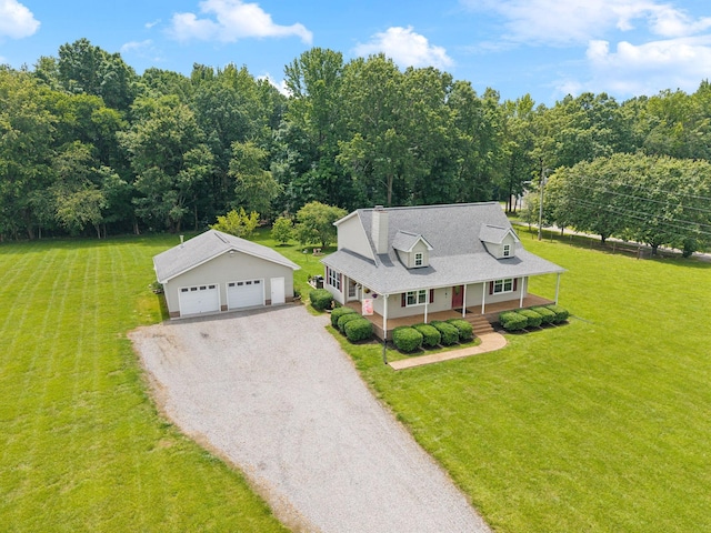 2917 York Rd, Pleasant View, TN 37146 - cape cod-style house with a porch, an outdoor structure, a garage, and a front lawn