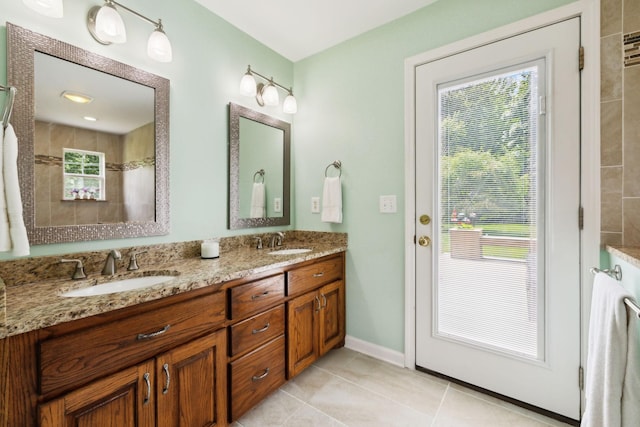 2917 York Rd, Pleasant View, TN 37146 - bathroom featuring double vanity, tile patterned floors, and baseboards