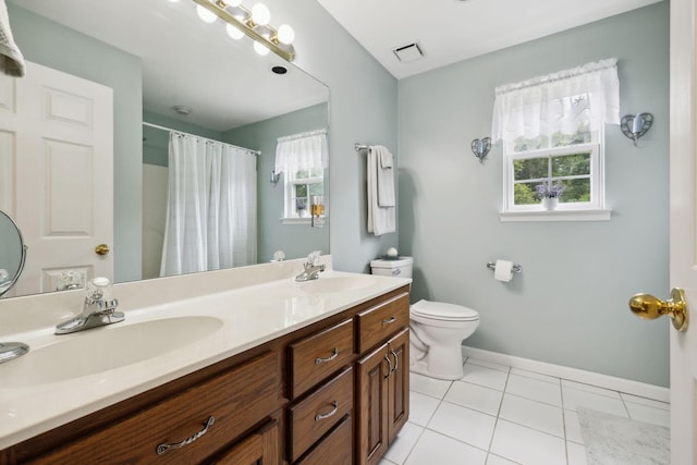 2917 York Rd, Pleasant View, TN 37146 - bathroom featuring plenty of natural light, double vanity, toilet, and tile patterned flooring