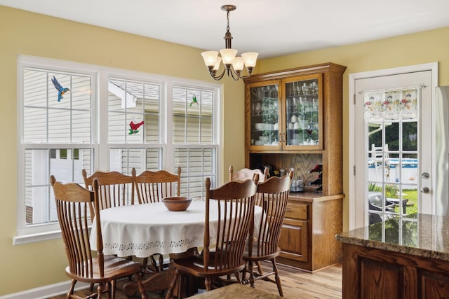 2917 York Rd, Pleasant View, TN 37146 - dining room featuring a chandelier and light wood finished floors