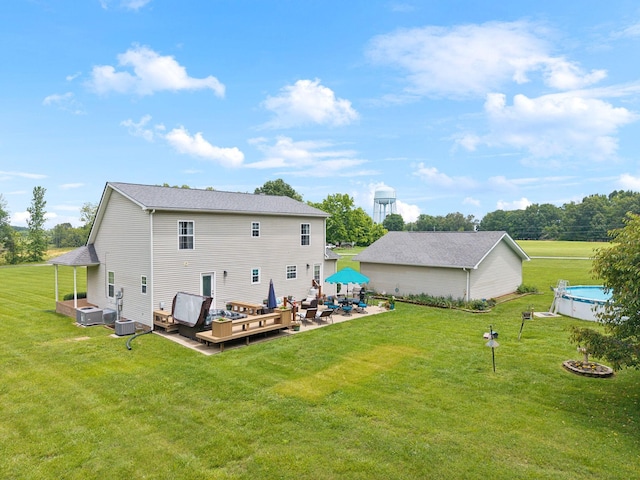 2917 York Rd, Pleasant View, TN 37146 - rear view of property featuring a deck, a yard, a patio area, and an outdoor living space with a fire pit