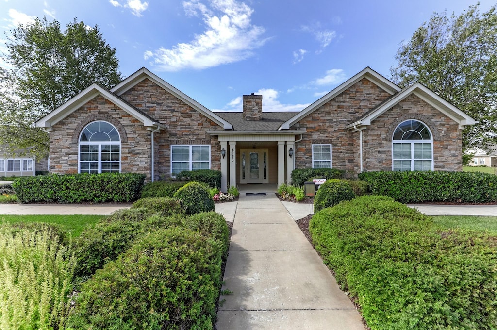 2333 Bridgeway St, Murfreesboro, TN 37128 - view of front of property with stone siding and a chimney