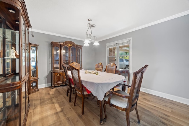 255 Whispering Hills Dr, Dover, TN 37058 - dining room featuring crown molding, wood finished floors, and baseboards