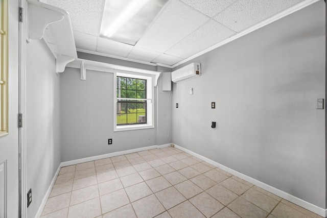 255 Whispering Hills Dr, Dover, TN 37058 - spare room featuring a wall mounted air conditioner, a drop ceiling, light tile patterned floors, and baseboards