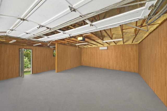 255 Whispering Hills Dr, Dover, TN 37058 - garage featuring wood walls and a garage door opener