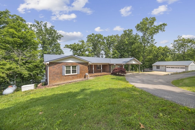 255 Whispering Hills Dr, Dover, TN 37058 - ranch-style home featuring brick siding, a front lawn, a detached garage, and a carport