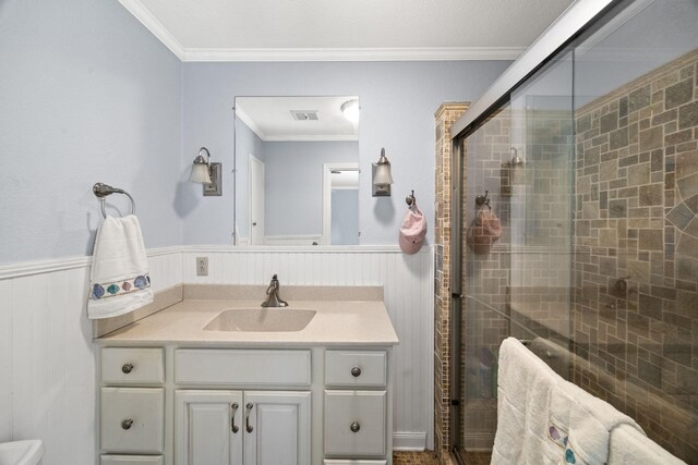 255 Whispering Hills Dr, Dover, TN 37058 - bathroom featuring vanity, crown molding, wainscoting, a shower stall, and toilet
