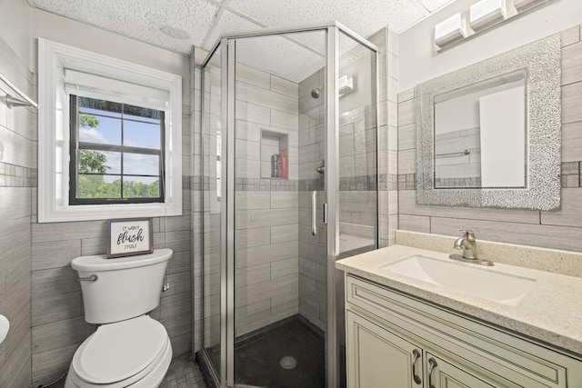 255 Whispering Hills Dr, Dover, TN 37058 - full bathroom with vanity, tile walls, toilet, and a shower stall