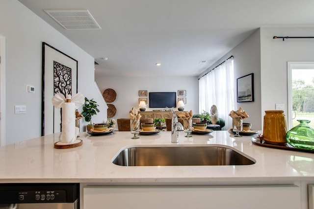 1752 Wren Way, Lebanon, TN 37087 - kitchen featuring dishwashing machine, open floor plan, light stone counters, recessed lighting, and a sink