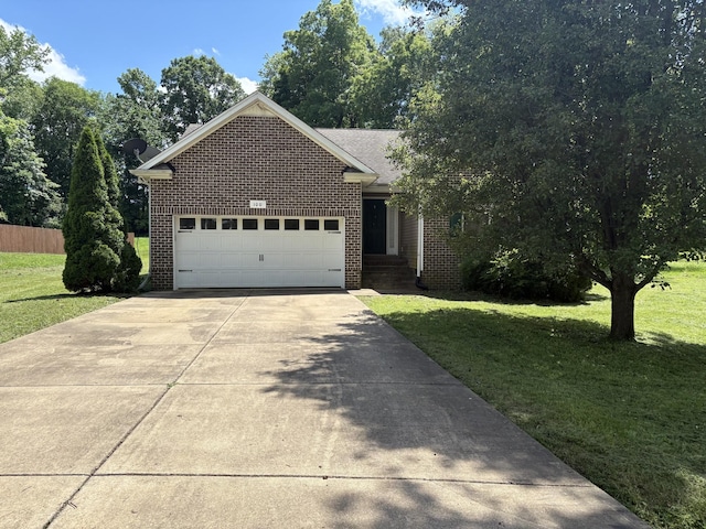 100 Hickory Pointe, Dickson, TN 37055 - view of front of house featuring brick siding, concrete driveway, and an attached garage