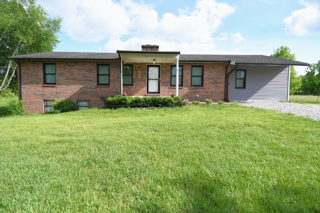 13276 Old Baxter Rd, Silver Point, TN 38582 - view of front facade with a front lawn, brick siding, and a chimney