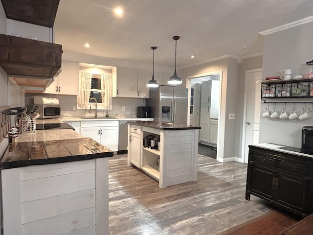 13276 Old Baxter Rd, Silver Point, TN 38582 - kitchen featuring appliances with stainless steel finishes, open shelves, a sink, crown molding, and white cabinets