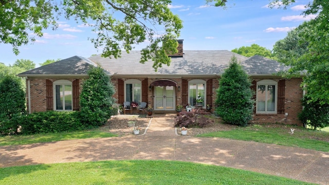 305 Rolling Mill Rd, Old Hickory, TN 37138 - view of front of house with brick siding, a chimney, french doors, and a porch