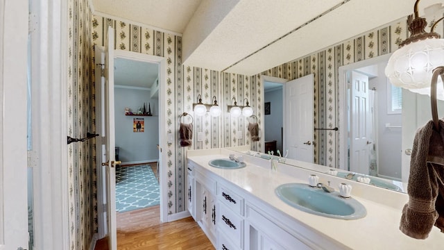 305 Rolling Mill Rd, Old Hickory, TN 37138 - full bath with wallpapered walls, double vanity, baseboards, wood finished floors, and crown molding