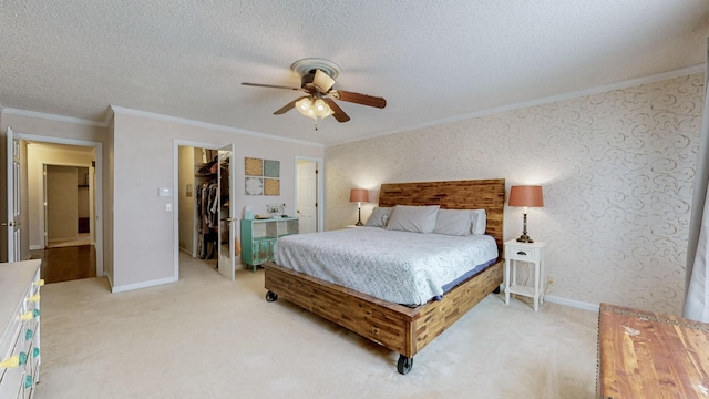 305 Rolling Mill Rd, Old Hickory, TN 37138 - bedroom featuring ornamental molding, a walk in closet, light carpet, a textured ceiling, and a closet