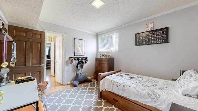 305 Rolling Mill Rd, Old Hickory, TN 37138 - bedroom with a textured ceiling, ornamental molding, and light wood-style floors