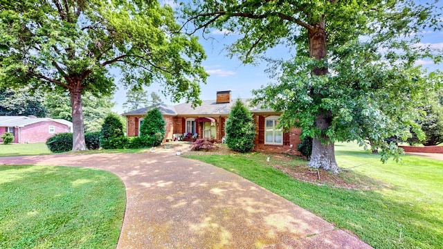 305 Rolling Mill Rd, Old Hickory, TN 37138 - single story home with a chimney, a front lawn, covered porch, and brick siding