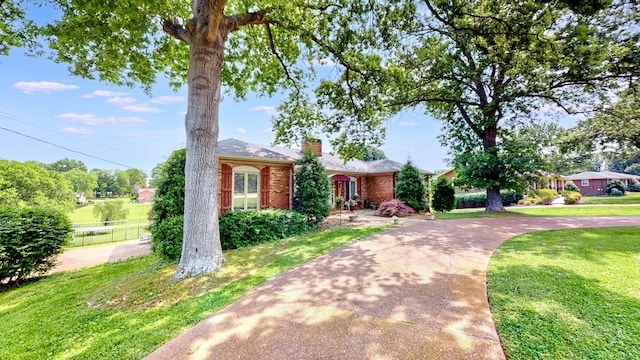 305 Rolling Mill Rd, Old Hickory, TN 37138 - view of front of home featuring a chimney, brick siding, and concrete driveway