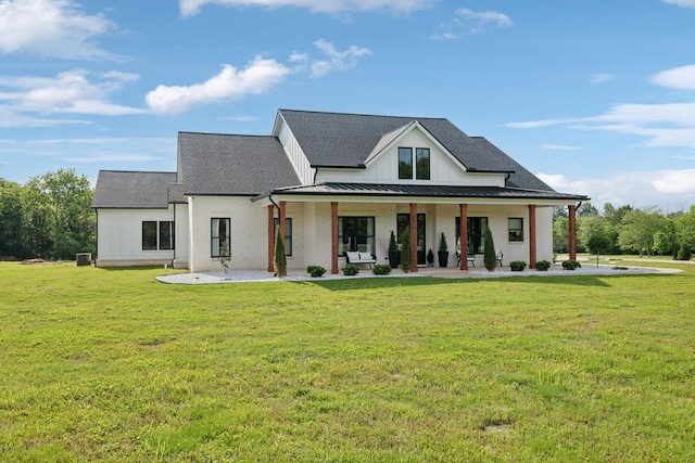 2648 Wilson Overall Rd, Murfreesboro, TN 37127 - modern inspired farmhouse with a front lawn, covered porch, board and batten siding, and roof with shingles