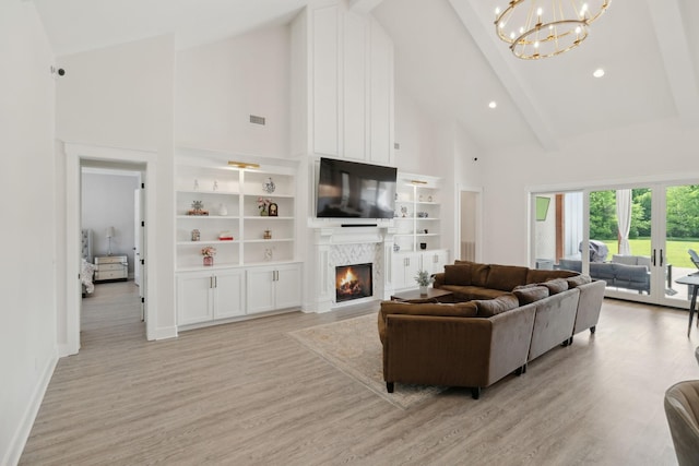 2648 Wilson Overall Rd, Murfreesboro, TN 37127 - living area featuring high vaulted ceiling, a fireplace, a chandelier, beamed ceiling, and light wood-type flooring