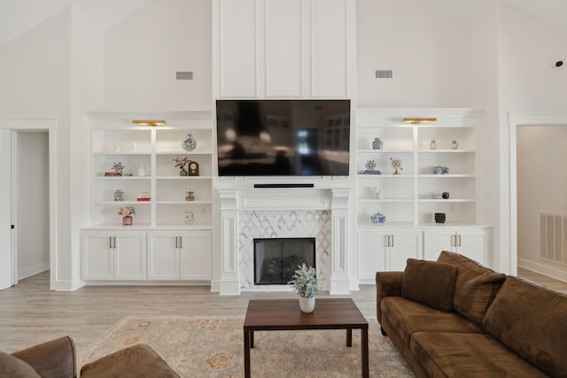 2648 Wilson Overall Rd, Murfreesboro, TN 37127 - living room featuring light wood finished floors, a high end fireplace, and baseboards