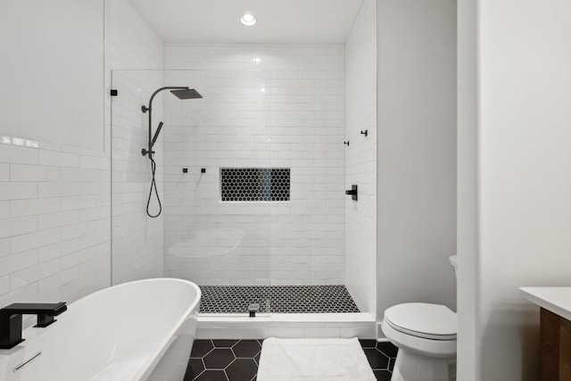2648 Wilson Overall Rd, Murfreesboro, TN 37127 - bathroom with a soaking tub, a tile shower, vanity, tile patterned flooring, and toilet