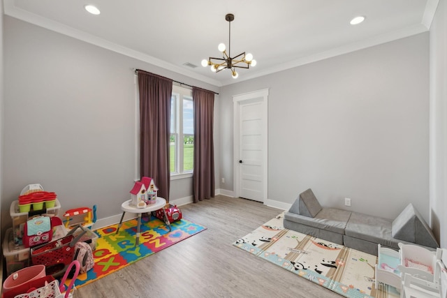 2648 Wilson Overall Rd, Murfreesboro, TN 37127 - rec room with a chandelier, wood finished floors, baseboards, crown molding, and recessed lighting