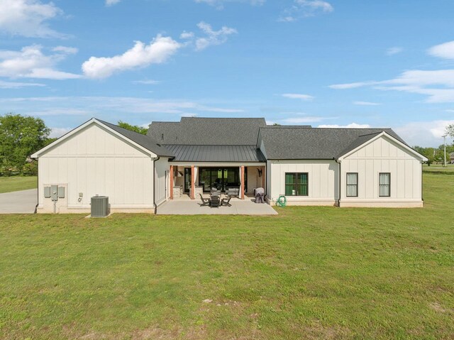 2648 Wilson Overall Rd, Murfreesboro, TN 37127 - rear view of house with board and batten siding, a lawn, a patio, and cooling unit