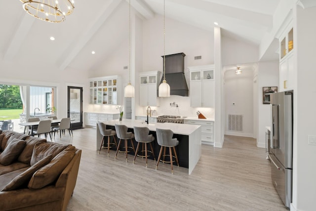 2648 Wilson Overall Rd, Murfreesboro, TN 37127 - kitchen featuring high quality fridge, custom exhaust hood, high vaulted ceiling, open floor plan, and light countertops