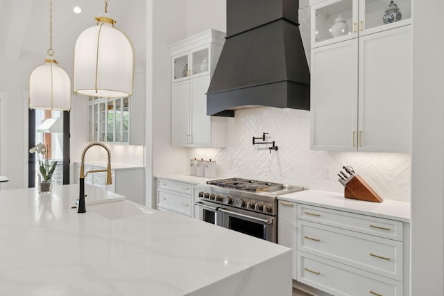 2648 Wilson Overall Rd, Murfreesboro, TN 37127 - kitchen with double oven range, custom exhaust hood, a sink, backsplash, and white cabinetry