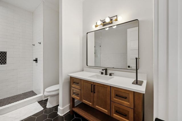 2648 Wilson Overall Rd, Murfreesboro, TN 37127 - bathroom featuring vanity, toilet, a tile shower, and tile patterned flooring