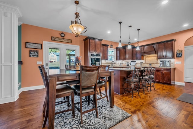 3112 Timberdale Dr, Clarksville, TN 37042 - dining space with dark wood finished floors, recessed lighting, baseboards, french doors, and arched walkways