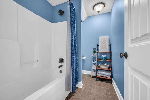 3112 Timberdale Dr, Clarksville, TN 37042 - bathroom with shower / bath combo with shower curtain, baseboards, and tile patterned flooring