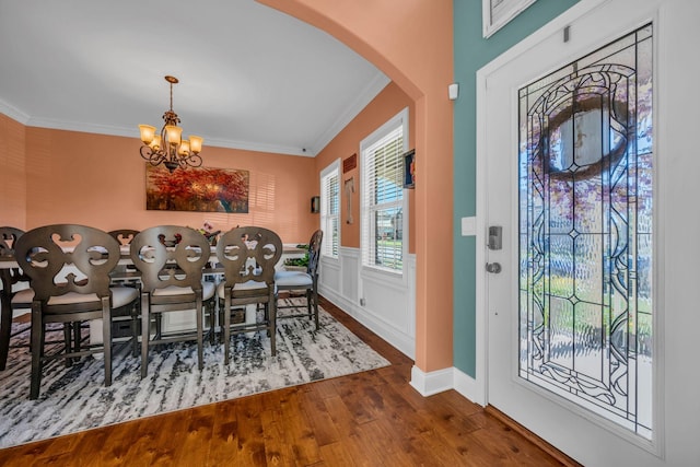 3112 Timberdale Dr, Clarksville, TN 37042 - dining room featuring arched walkways, wood finished floors, ornamental molding, and a chandelier