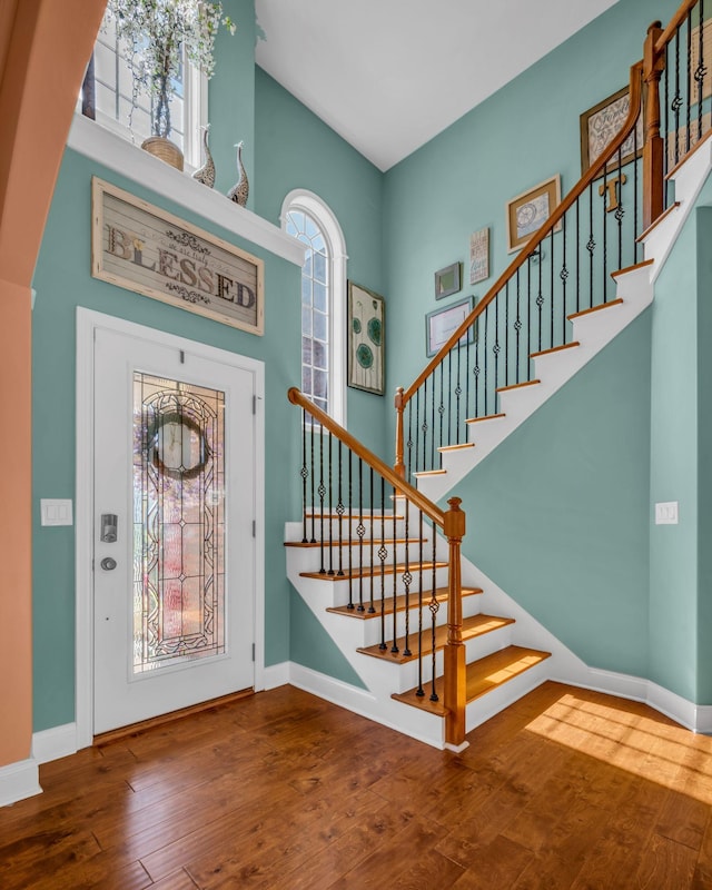 3112 Timberdale Dr, Clarksville, TN 37042 - entryway featuring hardwood / wood-style flooring, baseboards, stairs, and a towering ceiling