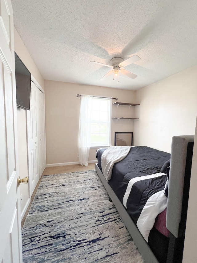 108 Josephines Ct, Oak Grove, KY 42262 - carpeted bedroom with a textured ceiling, a ceiling fan, a closet, and baseboards