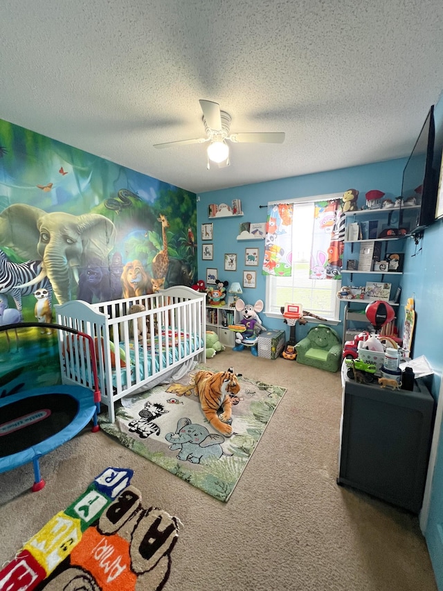 108 Josephines Ct, Oak Grove, KY 42262 - carpeted bedroom with a nursery area, a textured ceiling, and a ceiling fan