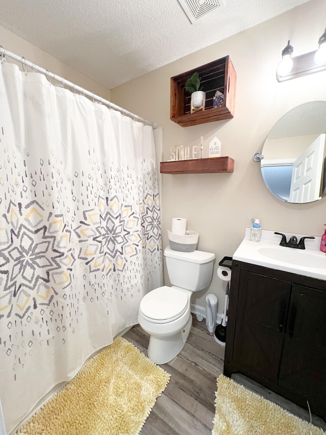 108 Josephines Ct, Oak Grove, KY 42262 - full bathroom featuring toilet, wood finished floors, vanity, a textured ceiling, and a shower with curtain