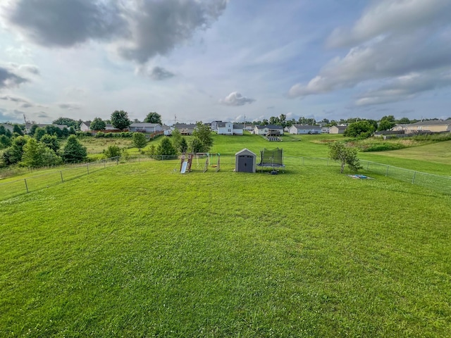 108 Josephines Ct, Oak Grove, KY 42262 - view of yard with a trampoline and a playground
