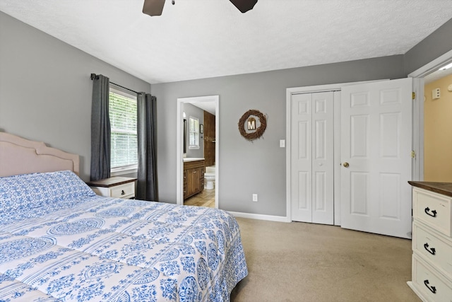 152 Scenic Cir, Ringgold, GA 30736 - bedroom with light colored carpet, baseboards, a closet, ceiling fan, and ensuite bath