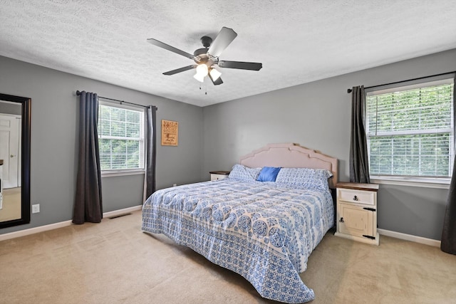 152 Scenic Cir, Ringgold, GA 30736 - bedroom featuring light colored carpet, baseboards, a textured ceiling, and ceiling fan