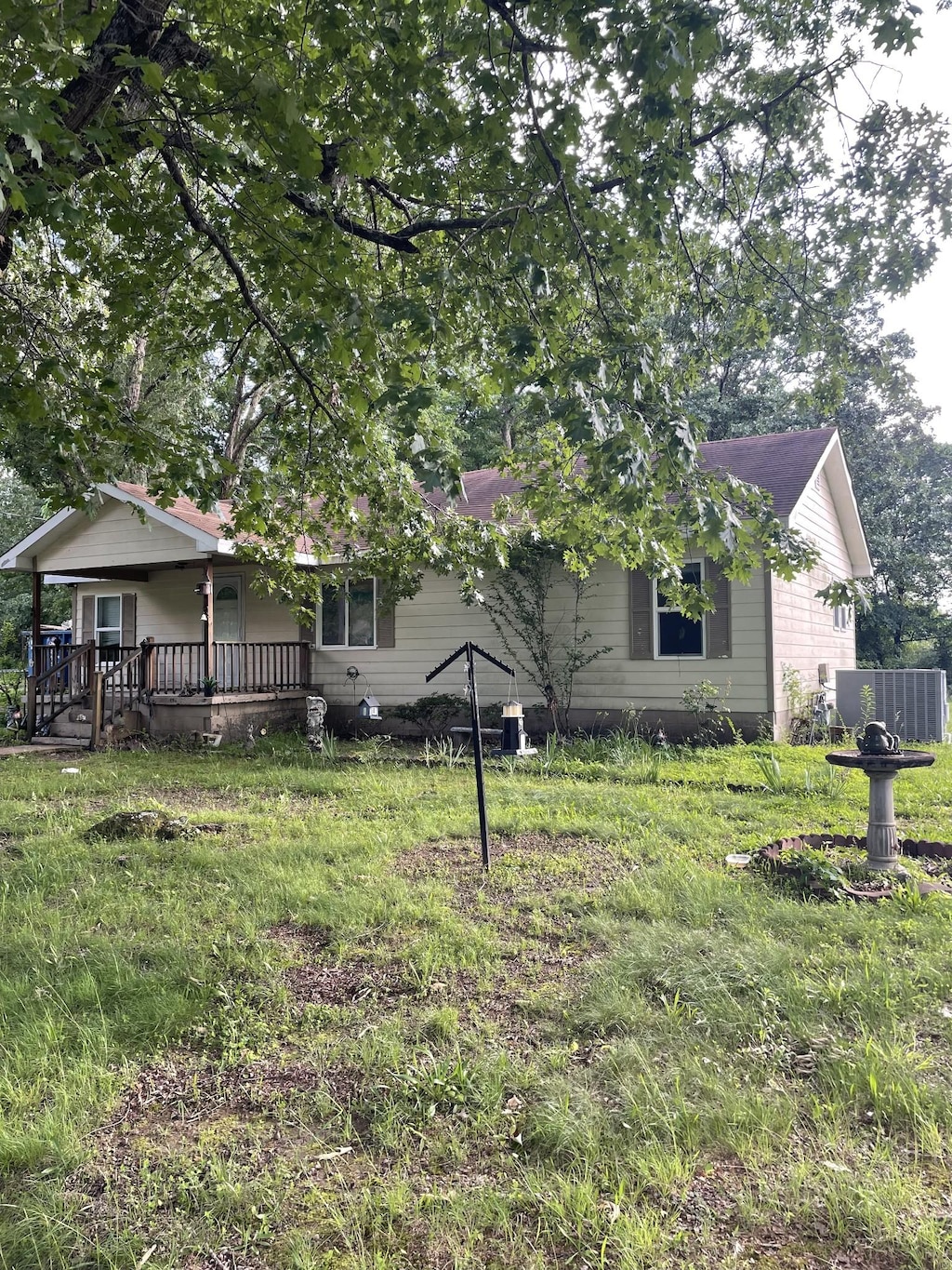 426 Eastside Dr, White Bluff, TN 37187 - view of front facade with central AC unit and covered porch