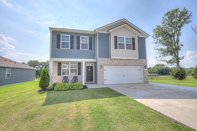 336 Ryan Rd, Chapel Hill, TN 37034 - view of front of house featuring brick siding, concrete driveway, an attached garage, and a front yard