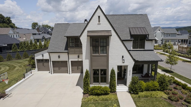 2026 Eliot Rd, Franklin, TN 37064 - view of front of property with a residential view, driveway, a standing seam roof, a porch, and a shingled roof
