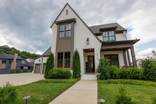 2026 Eliot Rd, Franklin, TN 37064 - view of front of house with a front yard, driveway, covered porch, and a shingled roof