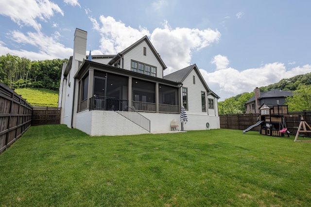 2026 Eliot Rd, Franklin, TN 37064 - rear view of house featuring a sunroom, a chimney, and a playground