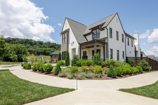 2026 Eliot Rd, Franklin, TN 37064 - view of property exterior with stucco siding, a shingled roof, and covered porch