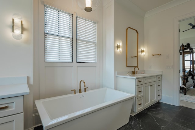 2026 Eliot Rd, Franklin, TN 37064 - bathroom featuring marble finish flooring, vanity, a soaking tub, and ornamental molding