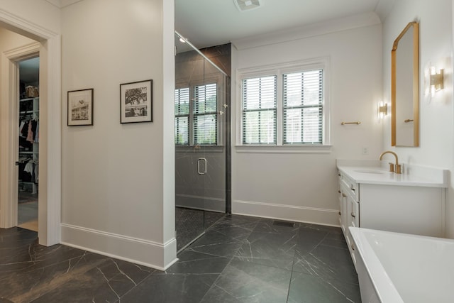 2026 Eliot Rd, Franklin, TN 37064 - full bathroom featuring marble tiled flooring, vanity, baseboards, and a freestanding tub