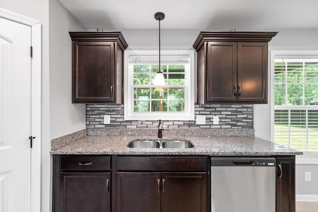324 Kildeer Dr, Clarksville, TN 37040 - kitchen with dishwasher, a sink, dark brown cabinets, and backsplash
